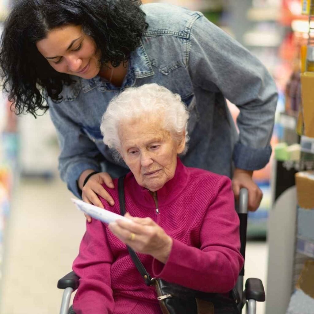 Woman assisting a senior.