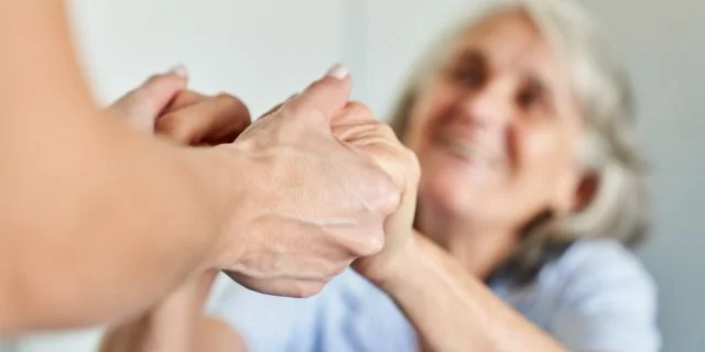 Caregiver helping dementia patient